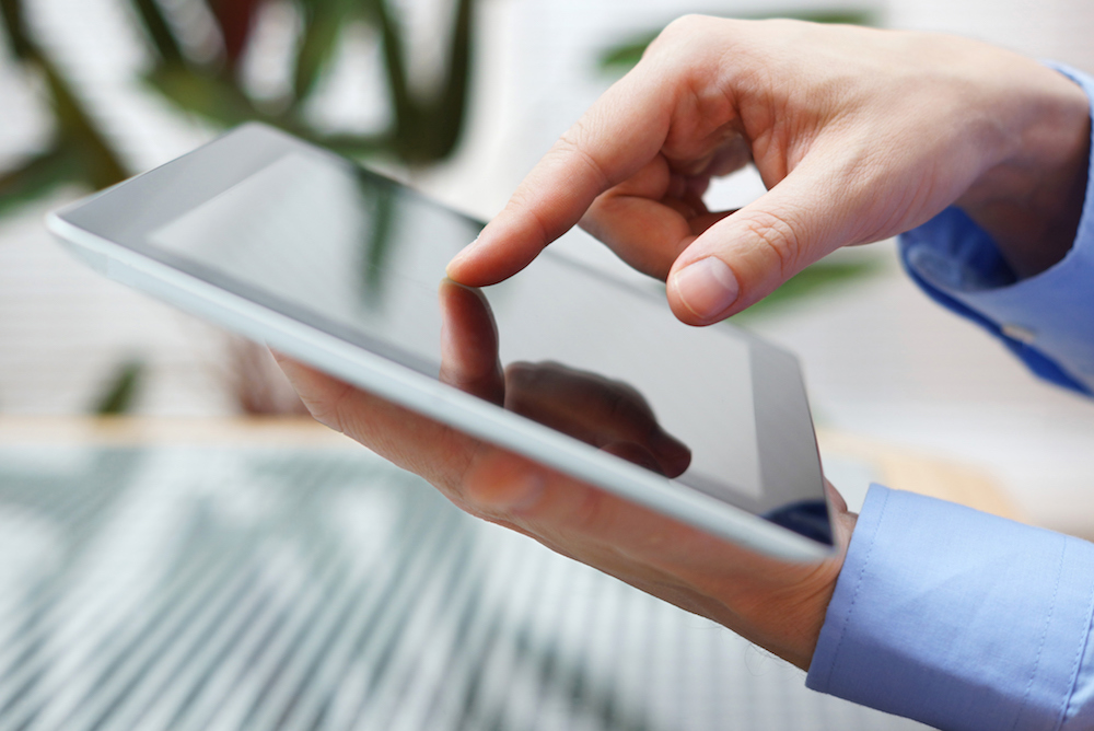 businessman using digital tablet, closeup