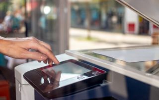 Businessman-using-refurbished-copier-for-their-small-business