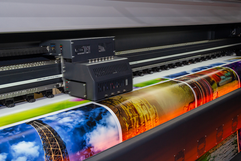Large format printing machine in operation. Industry Large format printing machine in operation. Industry