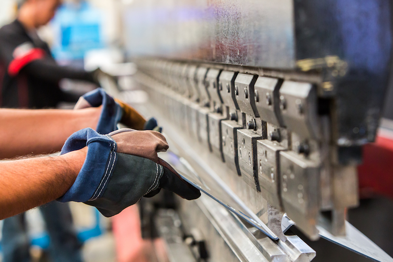 Sheet metal bending in factory manufacturing concept Sheet metal bending in factory