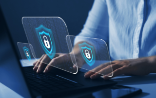 Close up of a woman at a laptop with lock security icons hovering over it signifying cybersecurity