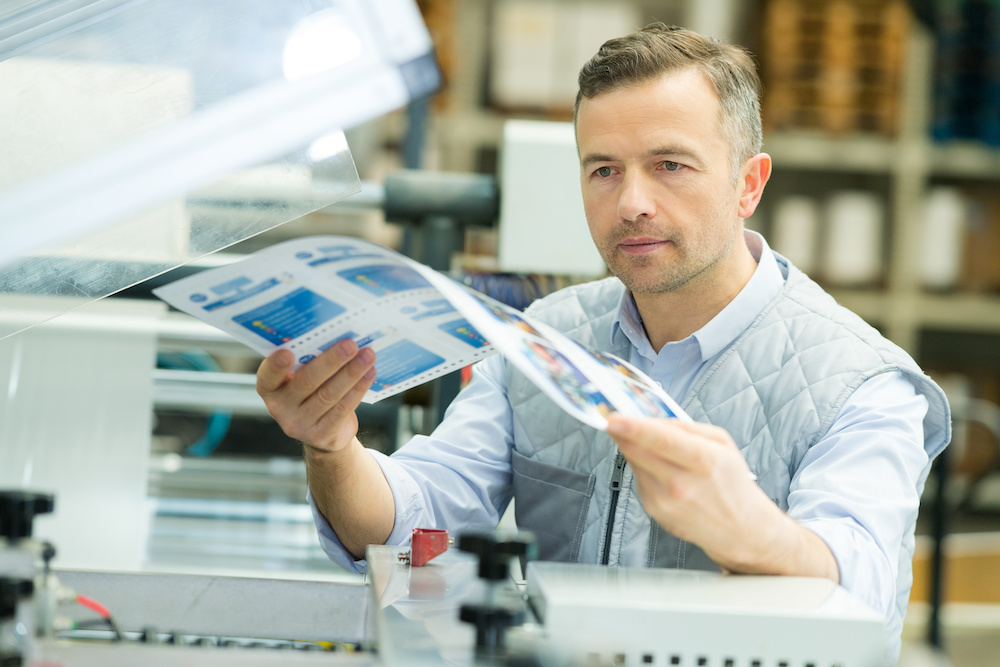 worker proofing printed matter from digital printing press